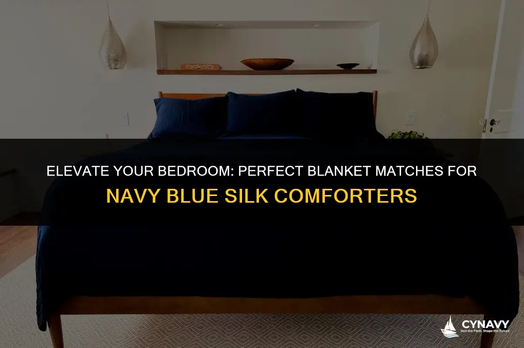 what color blanket coordinates with navy blue silk comforter