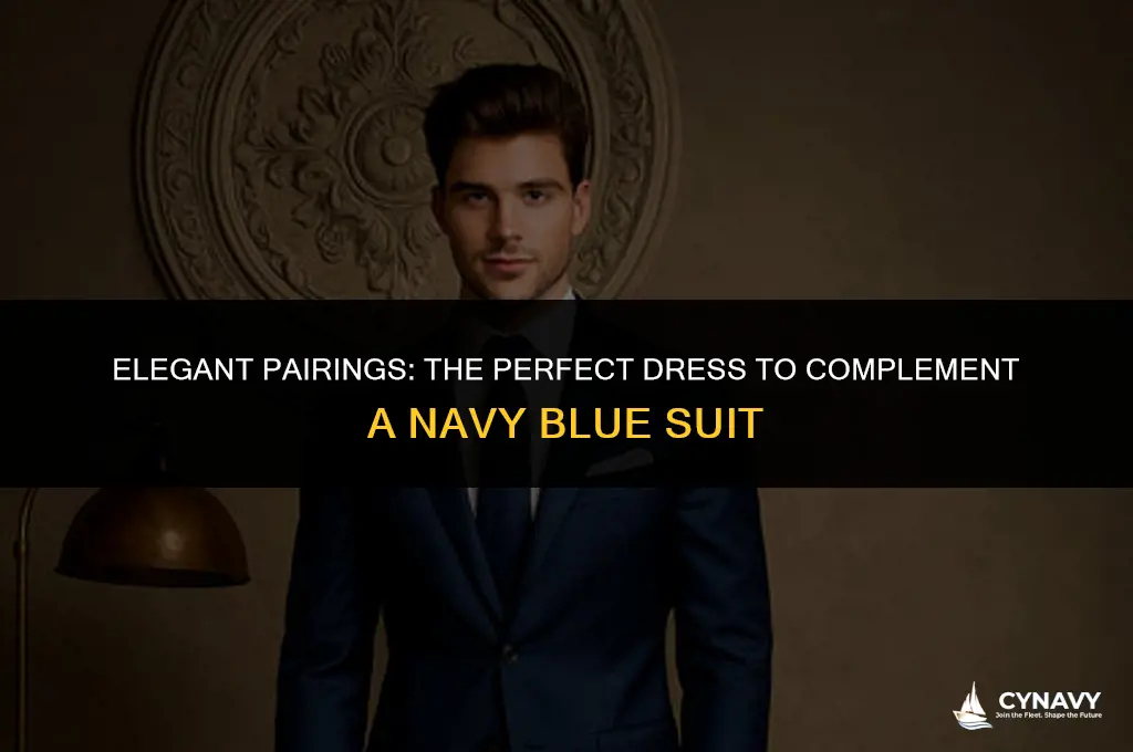 what color dress compliments a navy blue suit