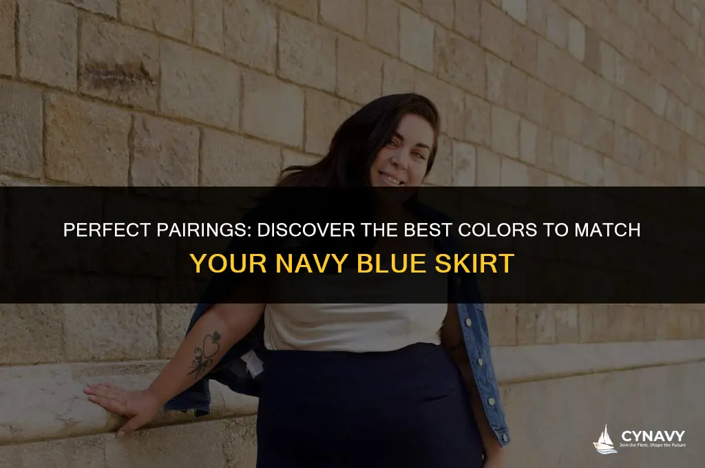 what color goes with navy blue skirt